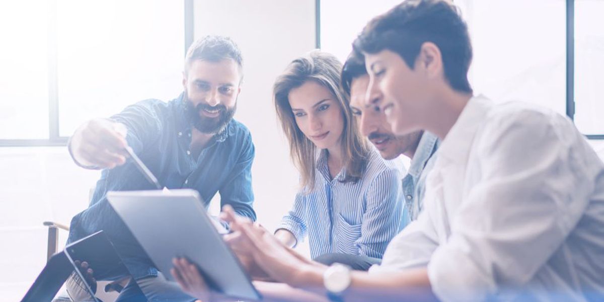 employees looking at screen